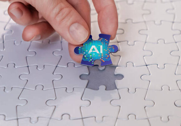 Hand placing a puzzle piece labeled 'AI' into a partially completed puzzle, symbolizing the integration of artificial intelligence.